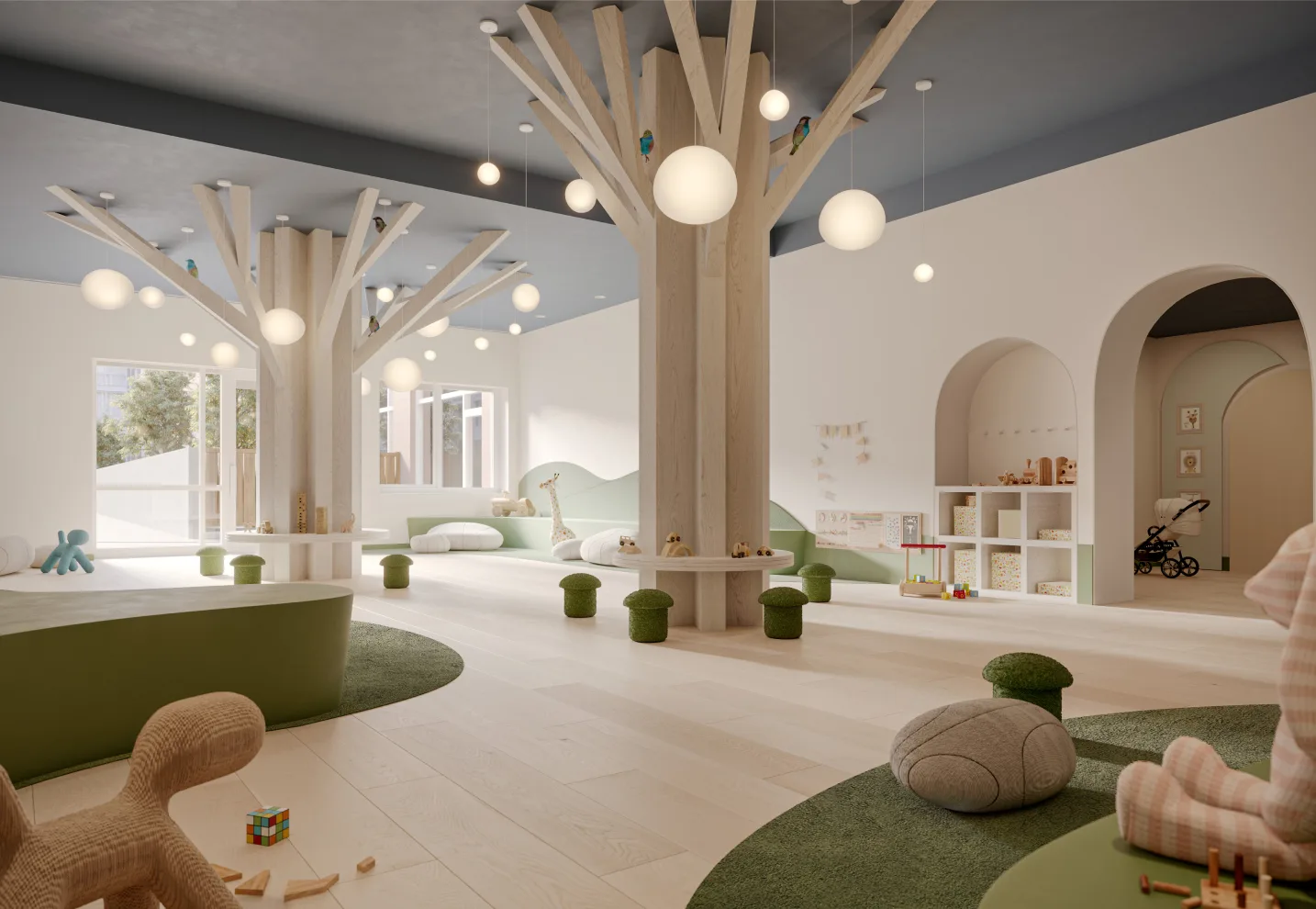 Elegant children's playroom with floor to ceiling tree sculptures, kids toys, and windows letting the light in from the 2nd floor courtyard.